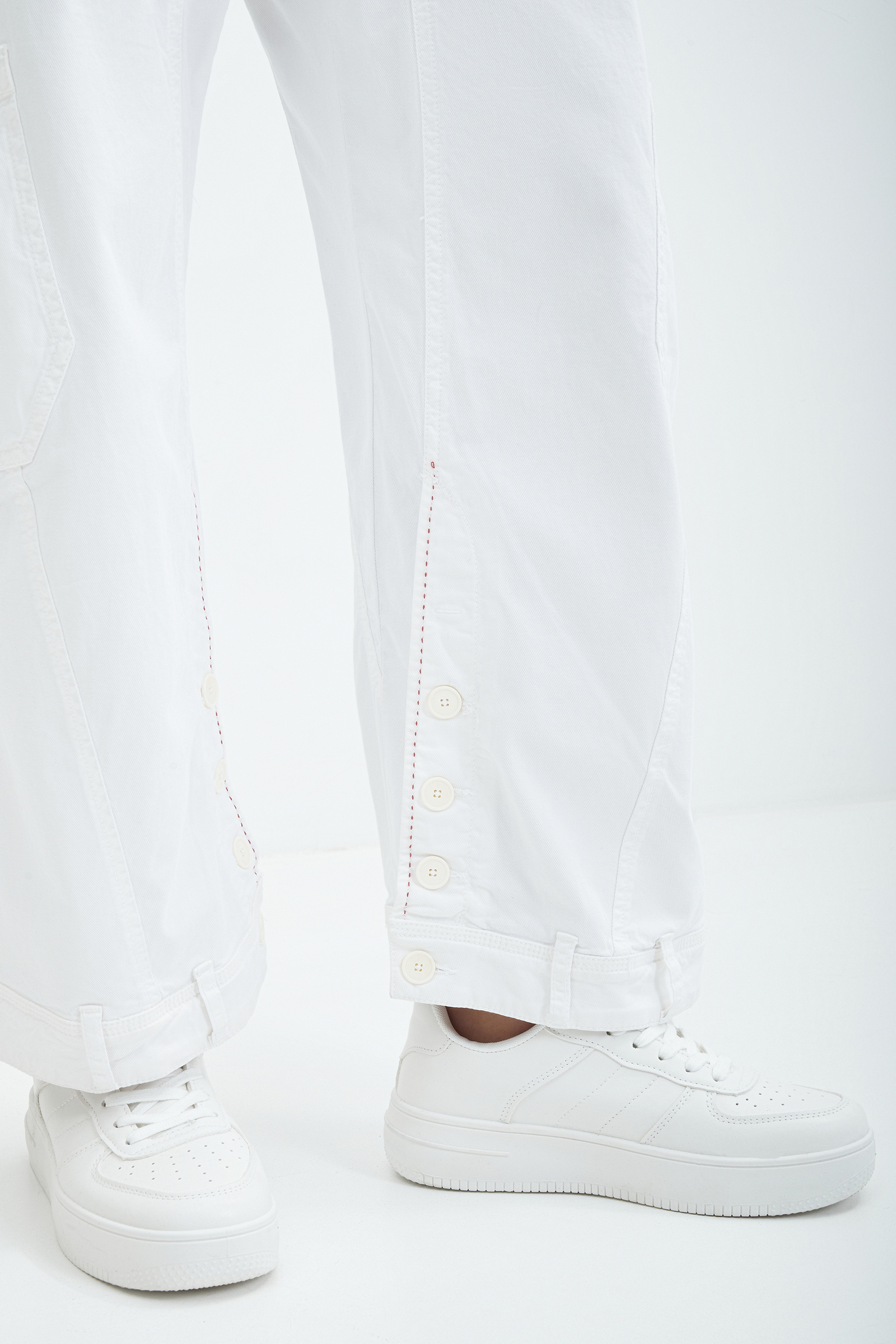 Джинсы багги с декоративным подолом Бренд High