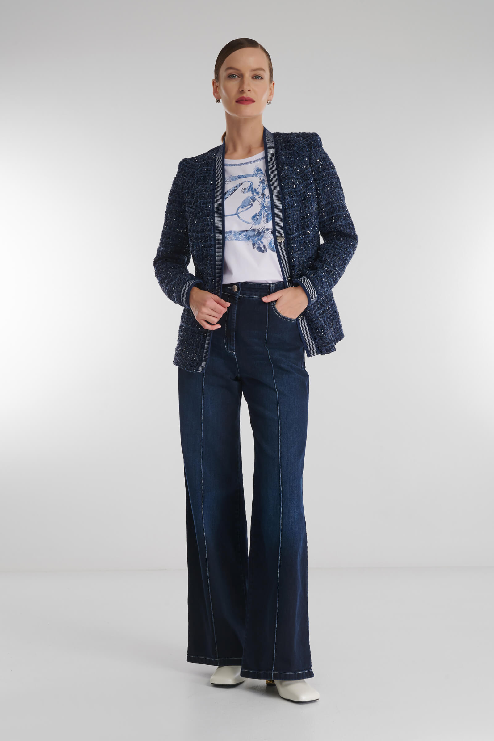 Расклешенные джинсы с простроченными стрелками Бренд Caterina Leman