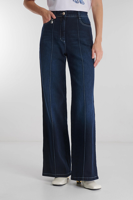 Расклешенные джинсы с простроченными стрелками Бренд Caterina Leman