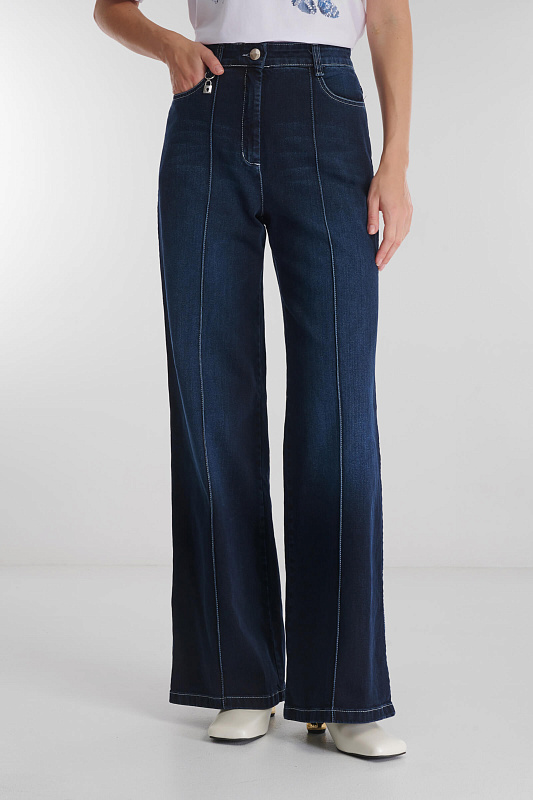 Расклешенные джинсы с простроченными стрелками Бренд Caterina Leman